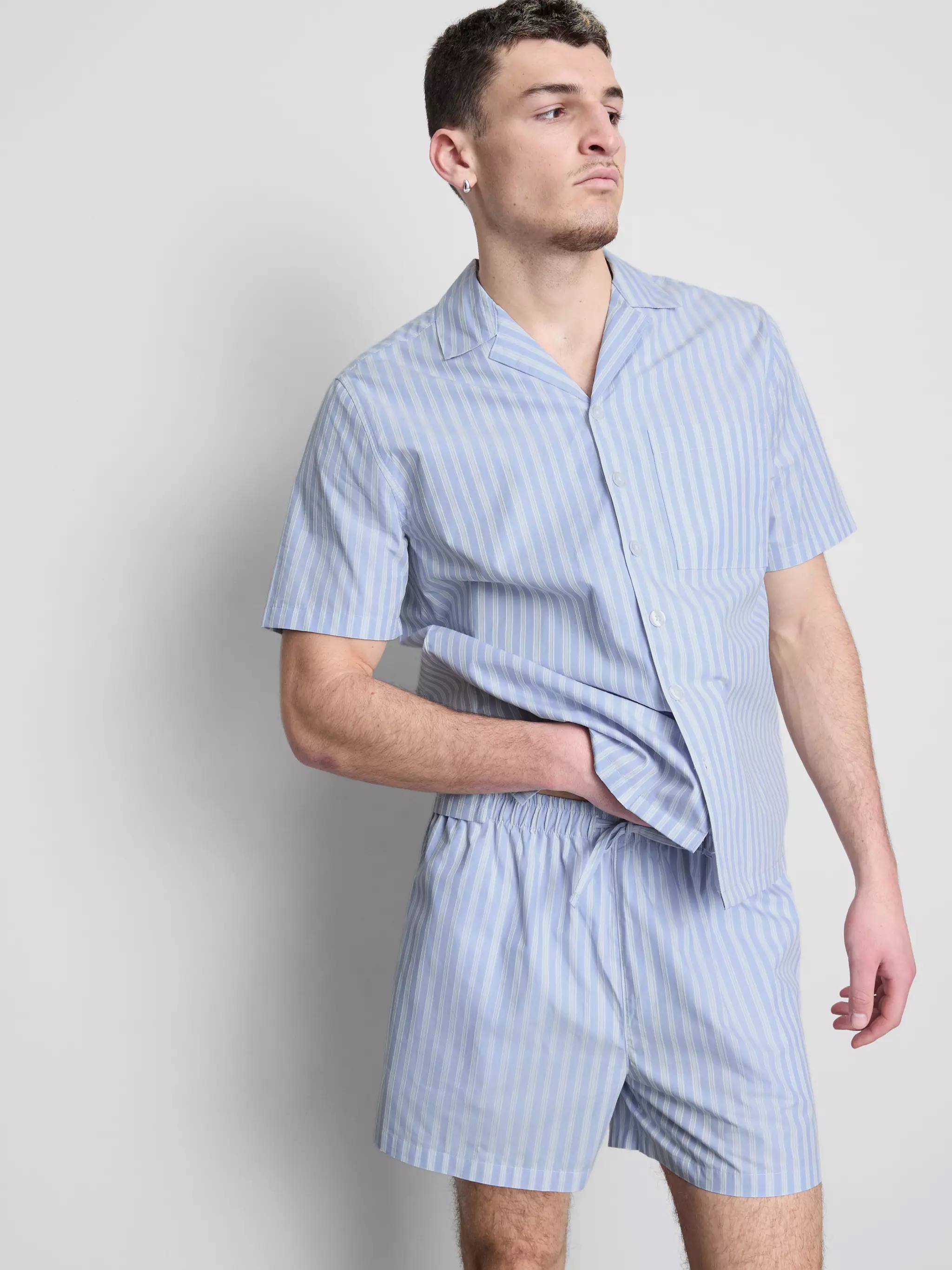 Man wearing a Striped Button-Up Pajama Shirt