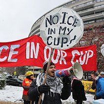 Demonstrators against the FIFA 2026 World Cup draw take part in a protest called "No ICE in my Cup!", in Washington, December 5, 2025.  © Francis Chung/POLITICO via AP Images