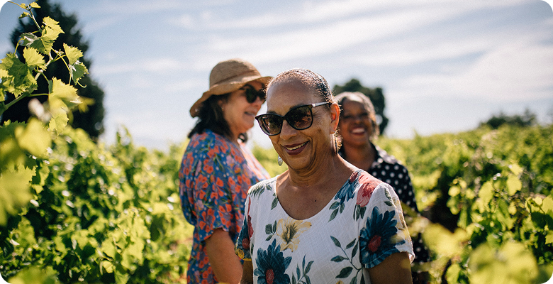 Women travelers together in a vineyard on France for Women: Paris, Loire Valley & Champagne Region — opens itinerary