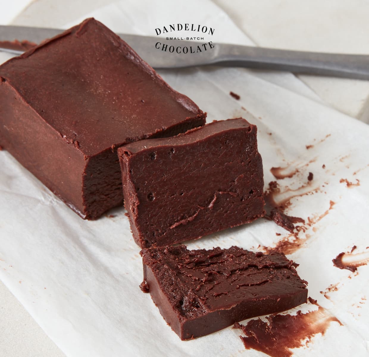 Half of a Tokyo Gâteau with two fudgy slivers sliced off. 