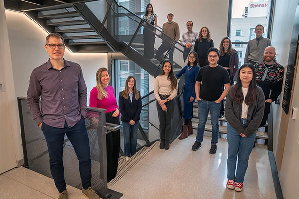 Duncan Watts (far left) and managing director Jeanne Ruane (second from left) with members of Penn’s Computational Social Sciences Lab. (Image: Courtesy of Inspiring Impact)