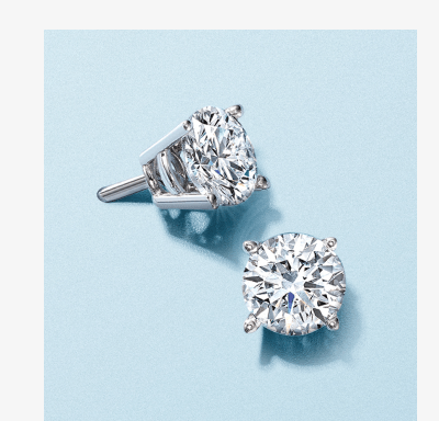 White gold diamond solitaire stud earrings.