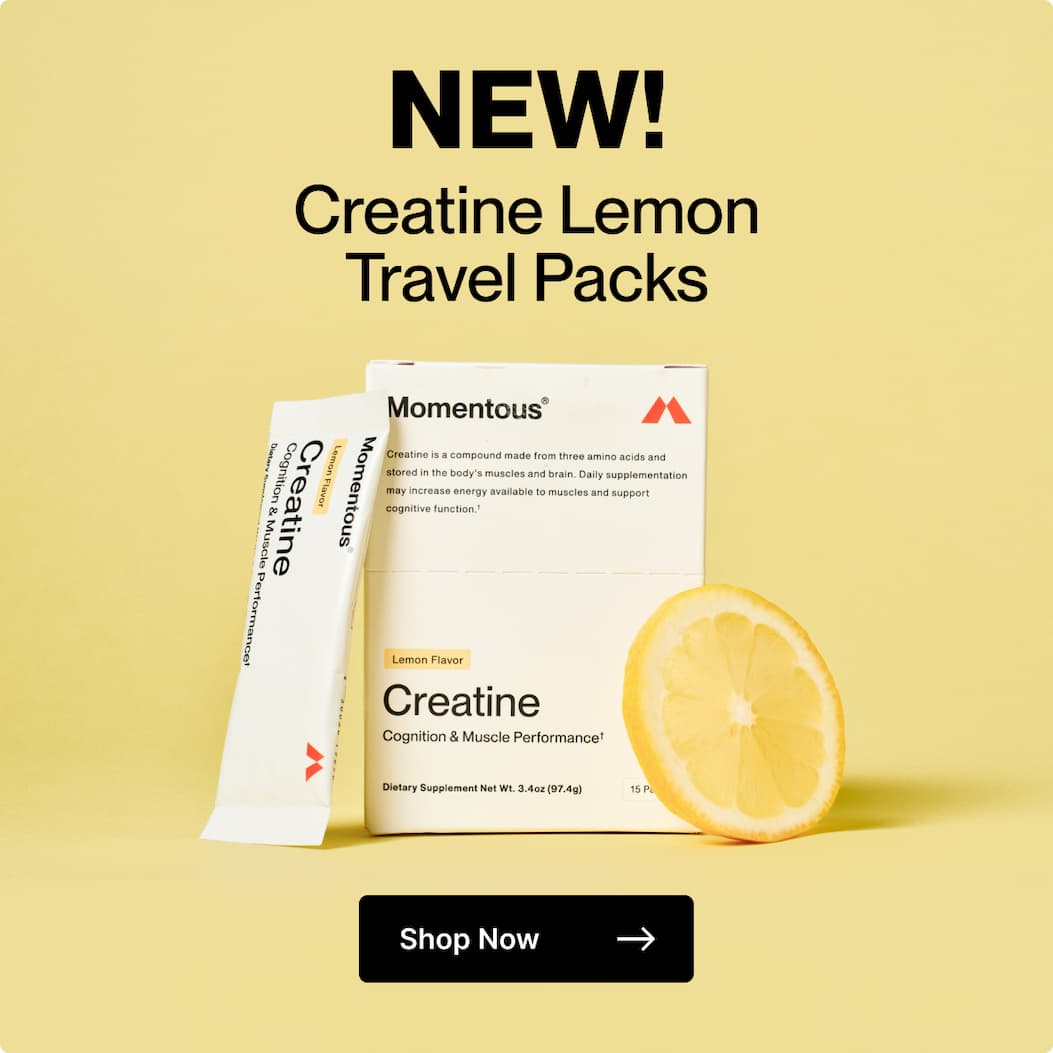 Momentous Creatine Lemon Travel Packs with product box, single-serve stick, and lemon slice on a yellow background.