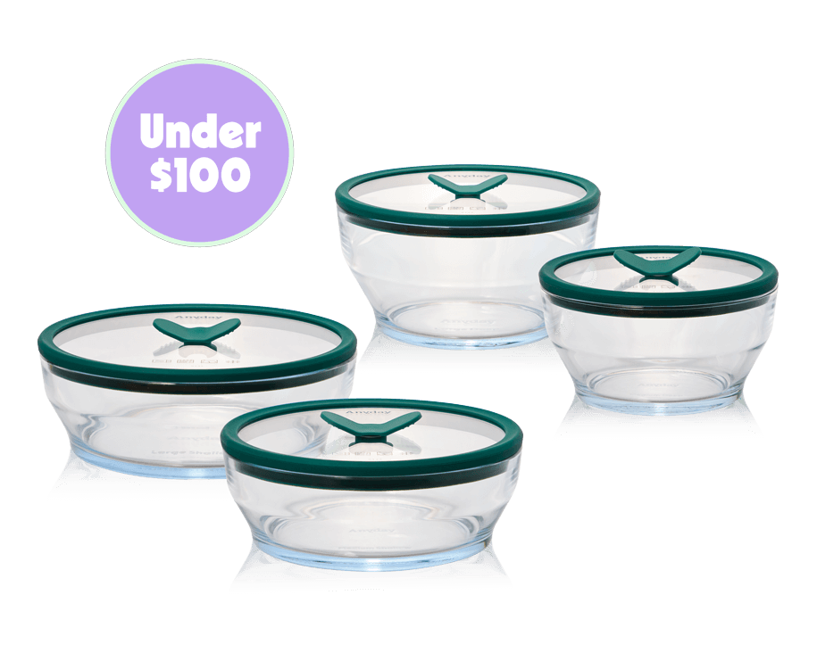 The Anyday Everything Dish Everyday Set, a plastic-free glass cooking and storage set with kale-green lids, shown with a "Under $100" label. This set includes essential dish sizes for everyday microwave cooking, storing, and reheating