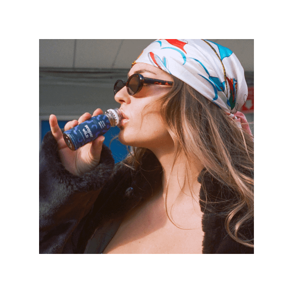 woman drinking a proper wild energy shot