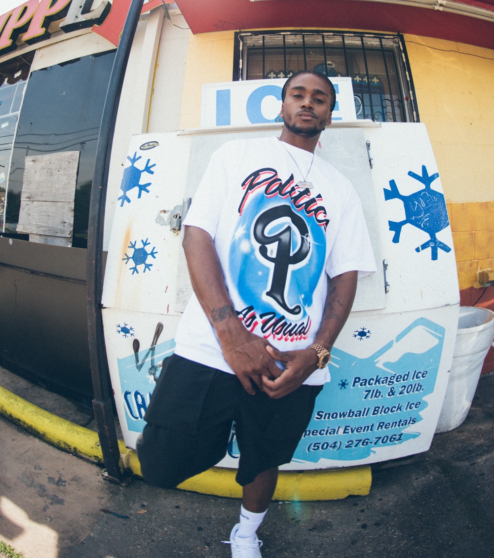 Model wearing a sneaker politics shirt
