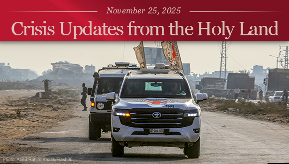 Two red cross vehicles in Gaza, transferring the body of a returned hostage to Israeli security forces.