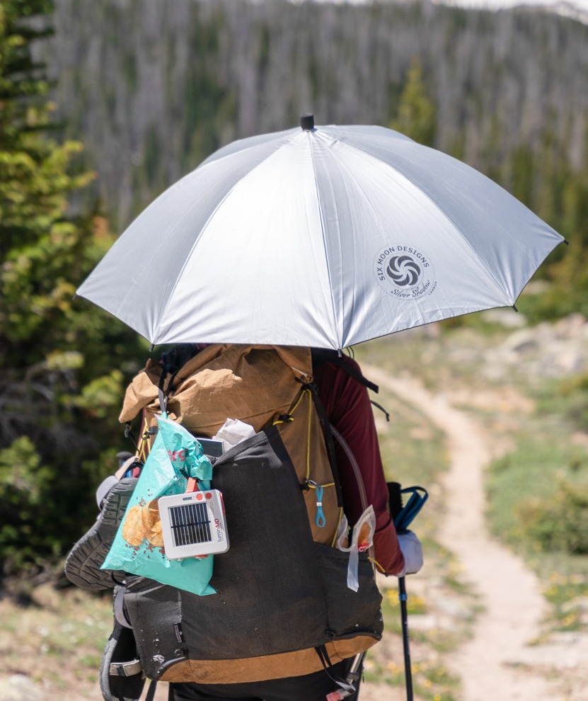 hiker with silver shadow carbon umbrella