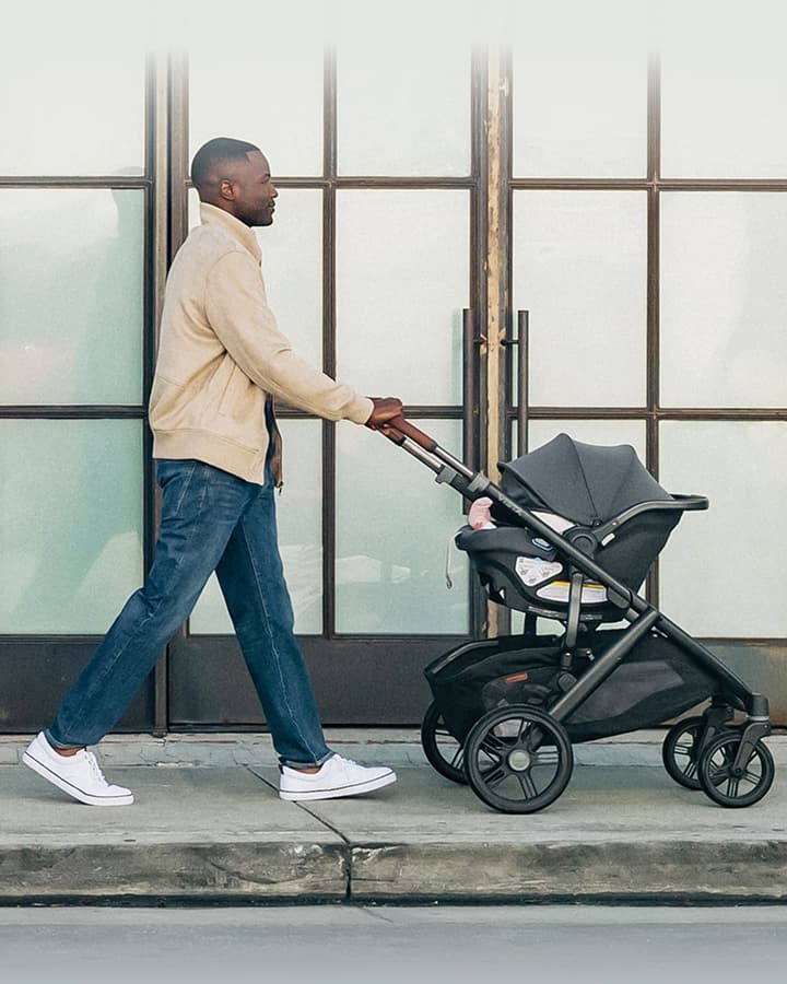 Dad pushing child in stroller