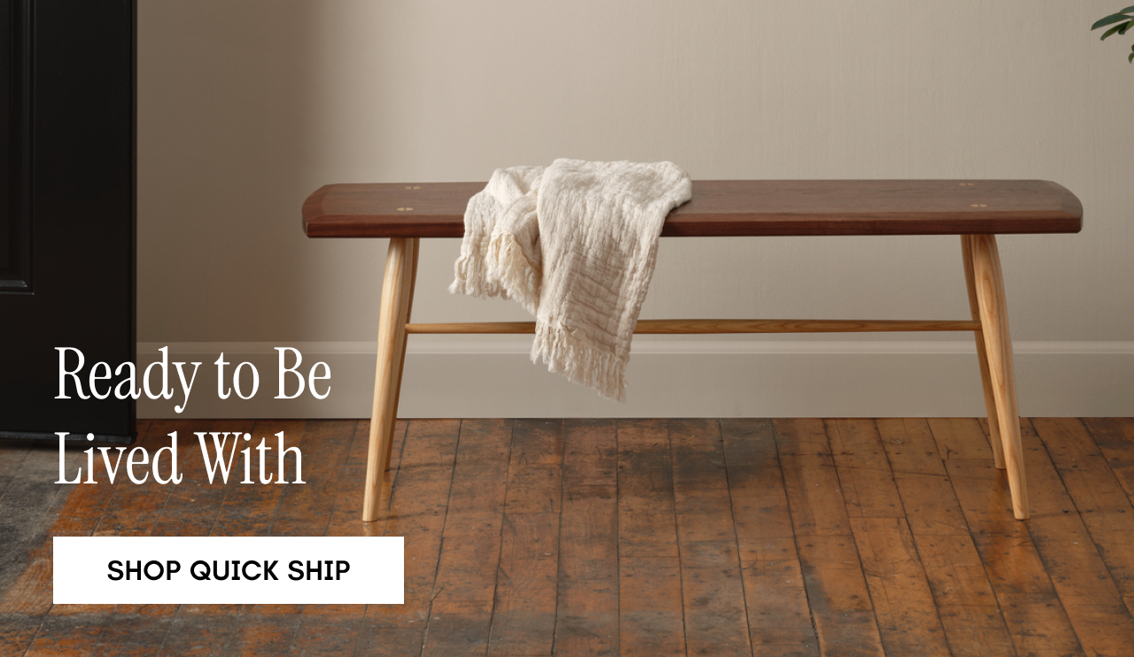 The Freeport Bench in walnut and a button that reads: Shop Seating.