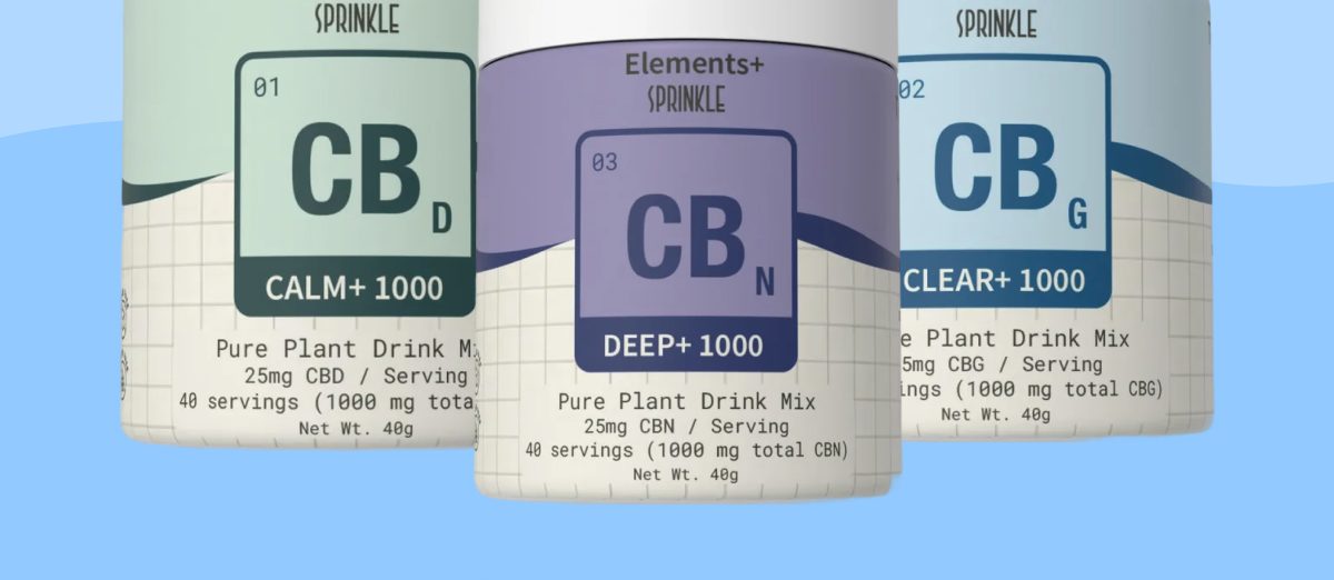 Three containers of Sprinkle drink mix with different labels and colors.