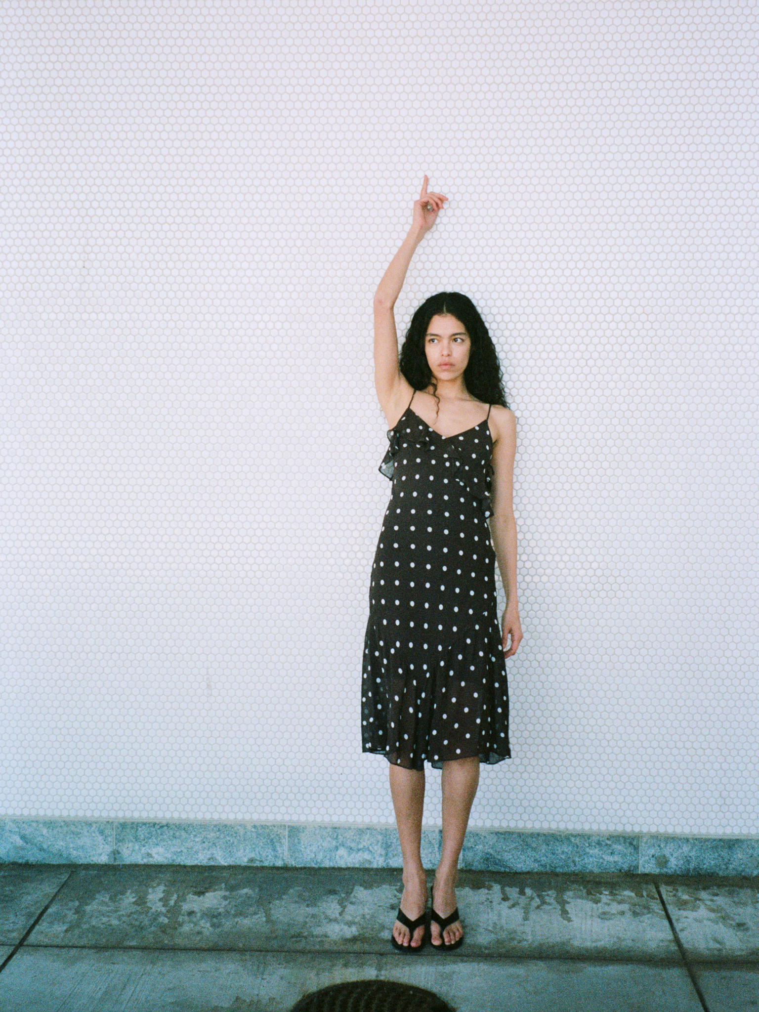 Girl in brown polka dotted dress