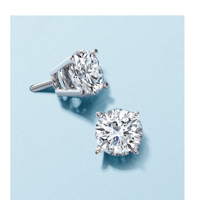 White gold diamond solitaire stud earrings.