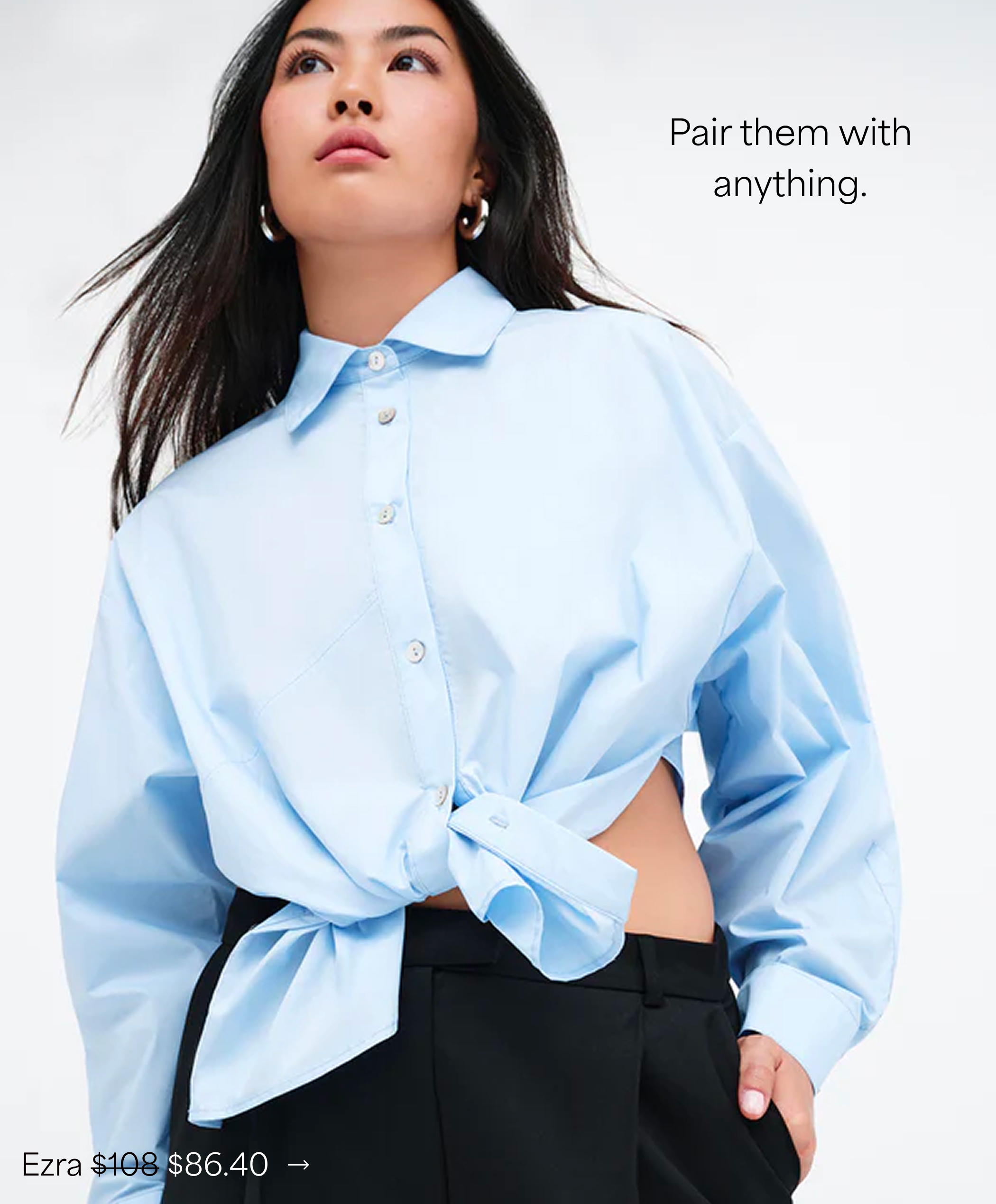 Shannon in The Ezra Shirt tied at the waist with black pants, labeled “Ezra $86.40.”