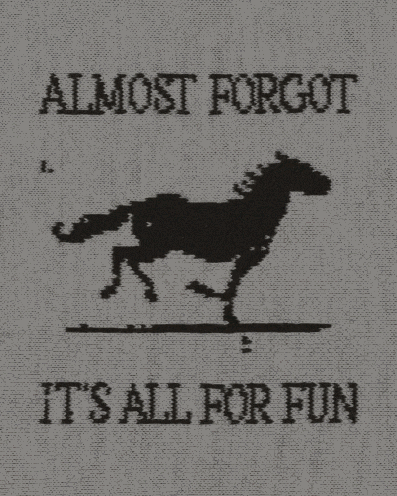 A stop-motion GIF of a black and white knit pattern showing a galloping horse. Text around the horse says: Almost forgot it's all for fun.