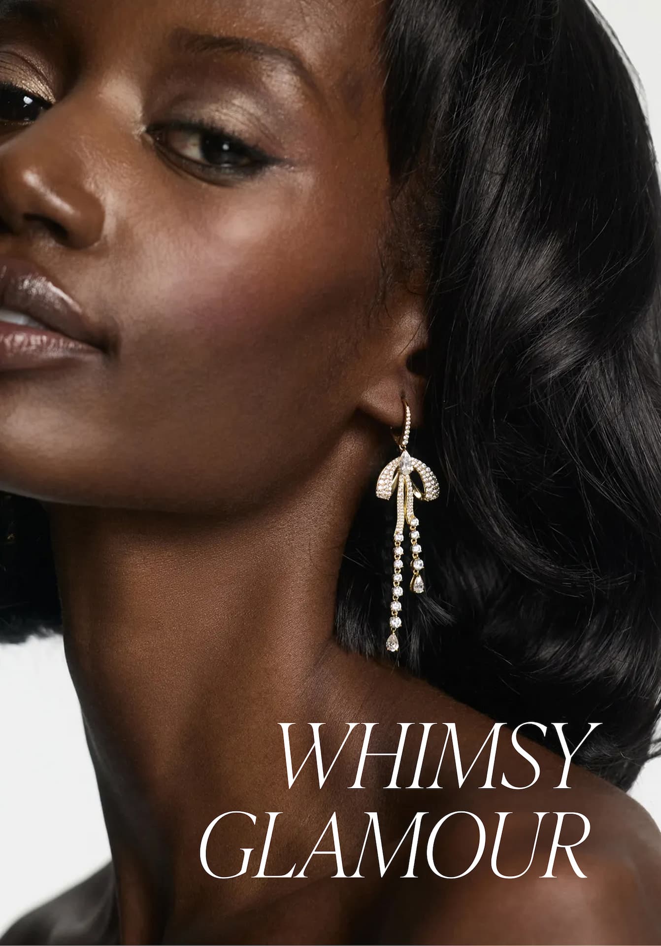 Image of model wearing EROS PAVE BOW LEVERBACK EARRINGS