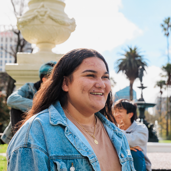 Student walking past the fountain at Albert Park