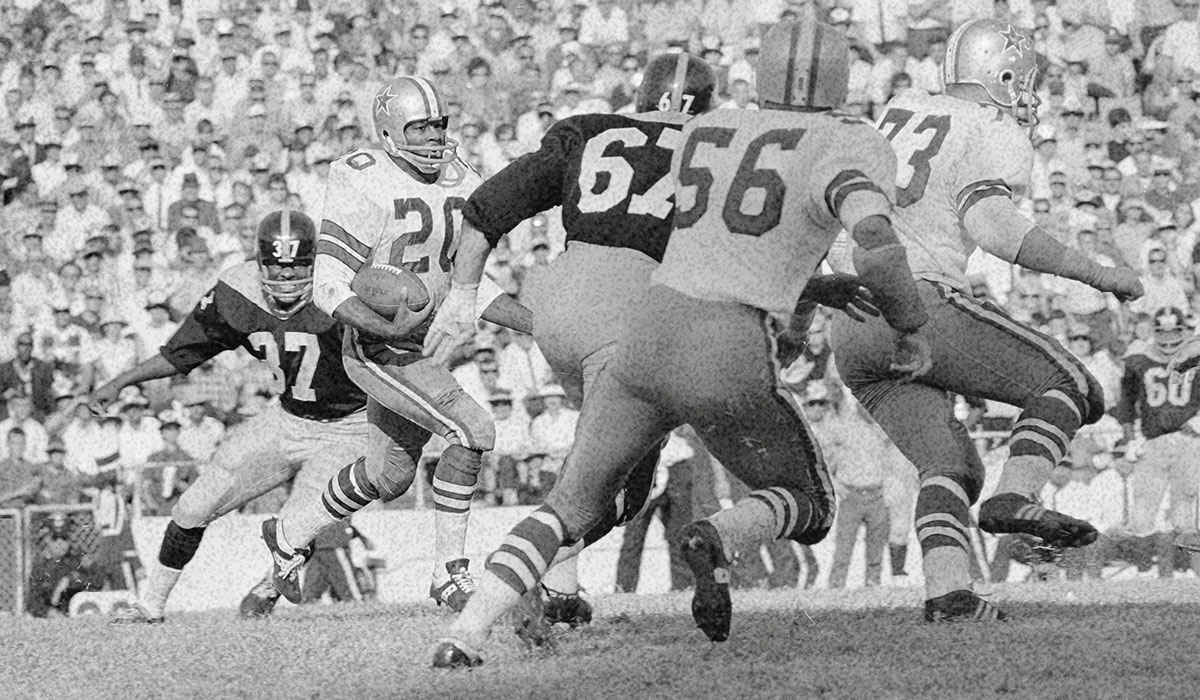 Old photo of football players playing.