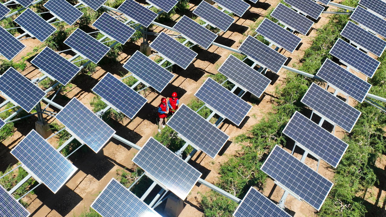 Workers carrying out a photovoltaic module inspection and electricity service in Yinchuan, China.