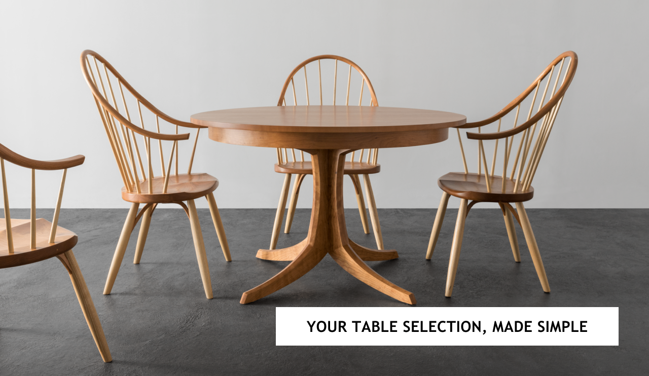 The Georgetown Pedestal Table with Continuous Arm Chairs in cherry.