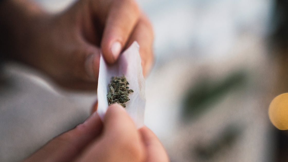 person-rolling-joint