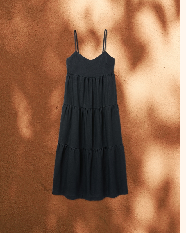 The Kathleen Dress is an effortless black maxi designed to go anywhere. With adjustable straps and a flattering empire waist, it's the perfect piece to wear on its own or layered year-round.