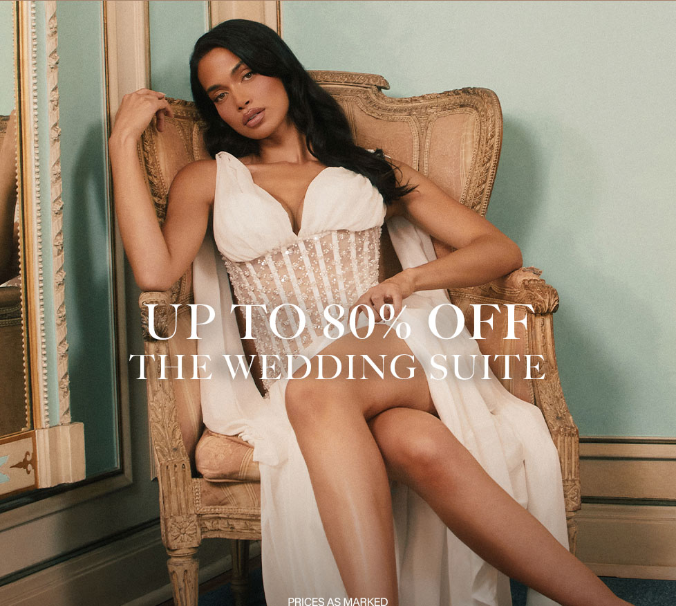 Up to 80% off The Wedding Suite sale! Elegant bride in white embellished corset gown. Shop bridal dresses & wedding outfits.