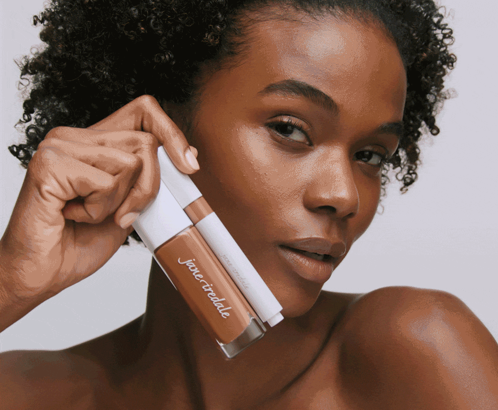 image of model holding Skintuition products 