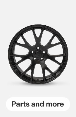 A Dodge Hellcat-style replica wheel on a gray tile.
