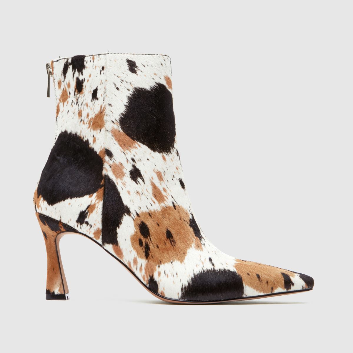 A cow print schuh heeled boot