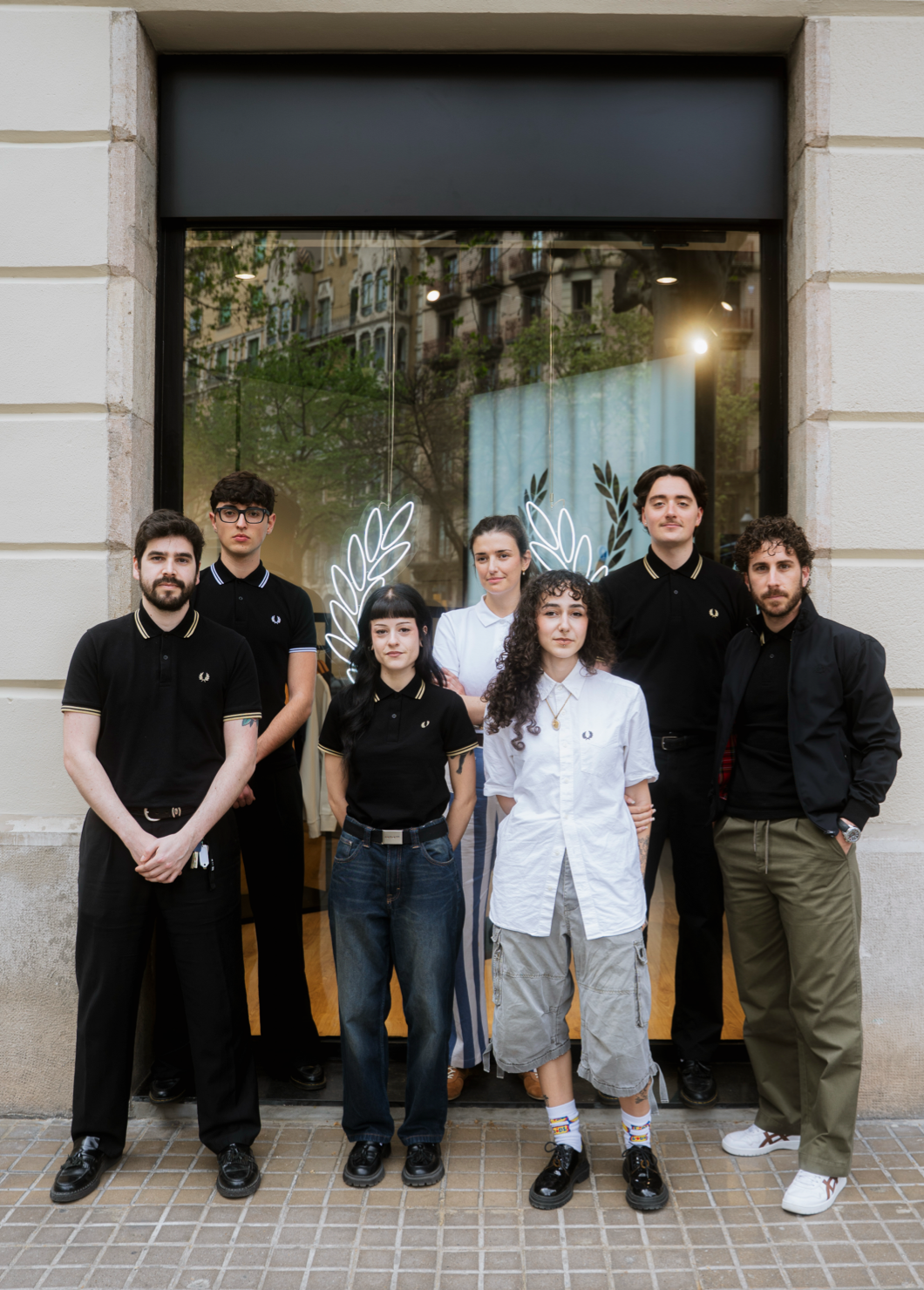 The Barcelona store opening: an image of 7 store staff members smiling outside the new store