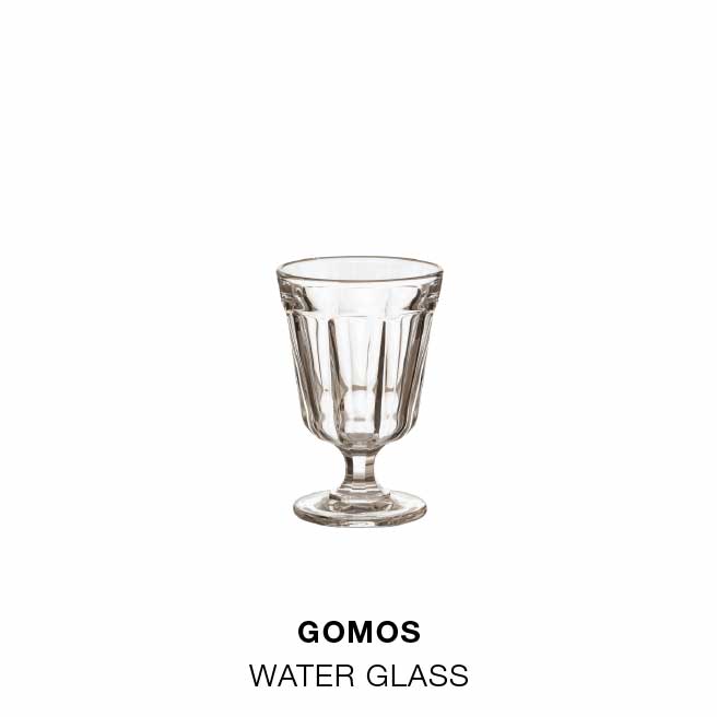 Styled for serving: Beja dinner plate in white with a red rim, Beja soup/pasta plate in white with a red rim and Gomos water glass in glass