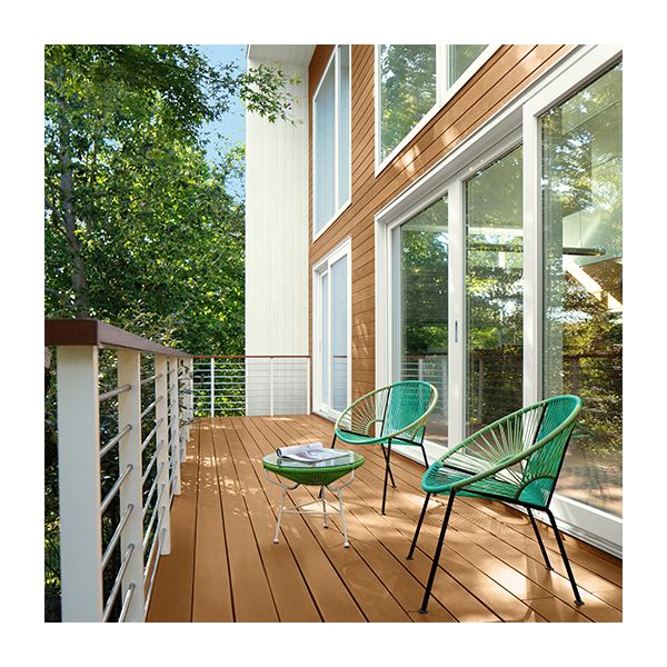 A house with exterior siding and a back deck in light brown stained wood and white trim.