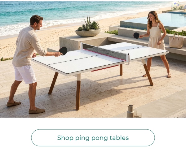 Couple playing outdoor ping pong poolside. Button Text: Shop ping pong tables