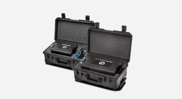 Two open black rugged cases, each containing electronic devices.
