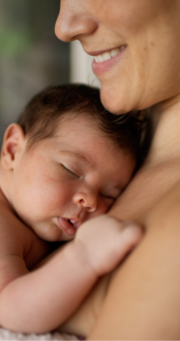 Image of woman cuddling baby