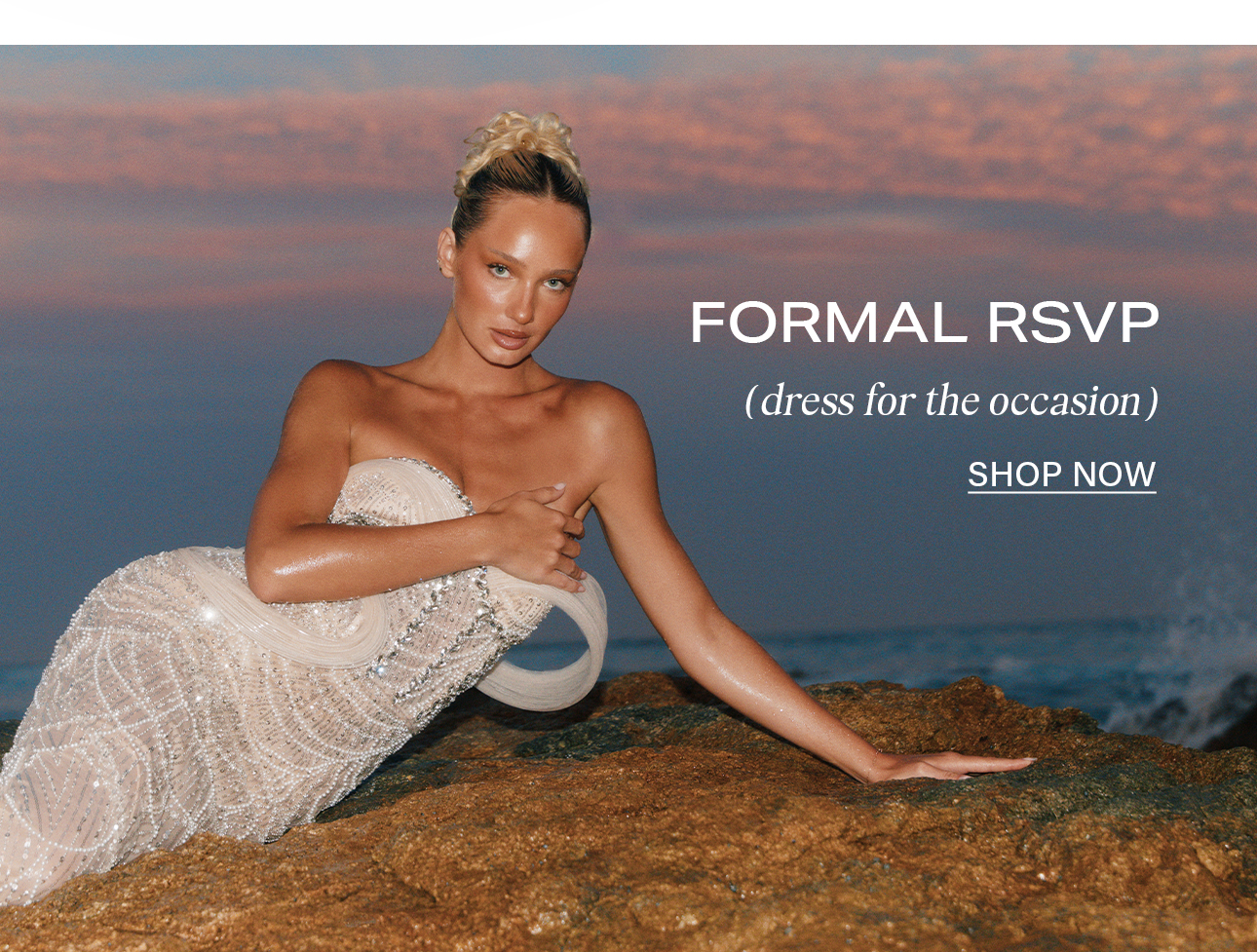 Formal RSVP: Woman in a dazzling sequin strapless gown on beach rocks. Shop elegant formal dresses for special occasions.