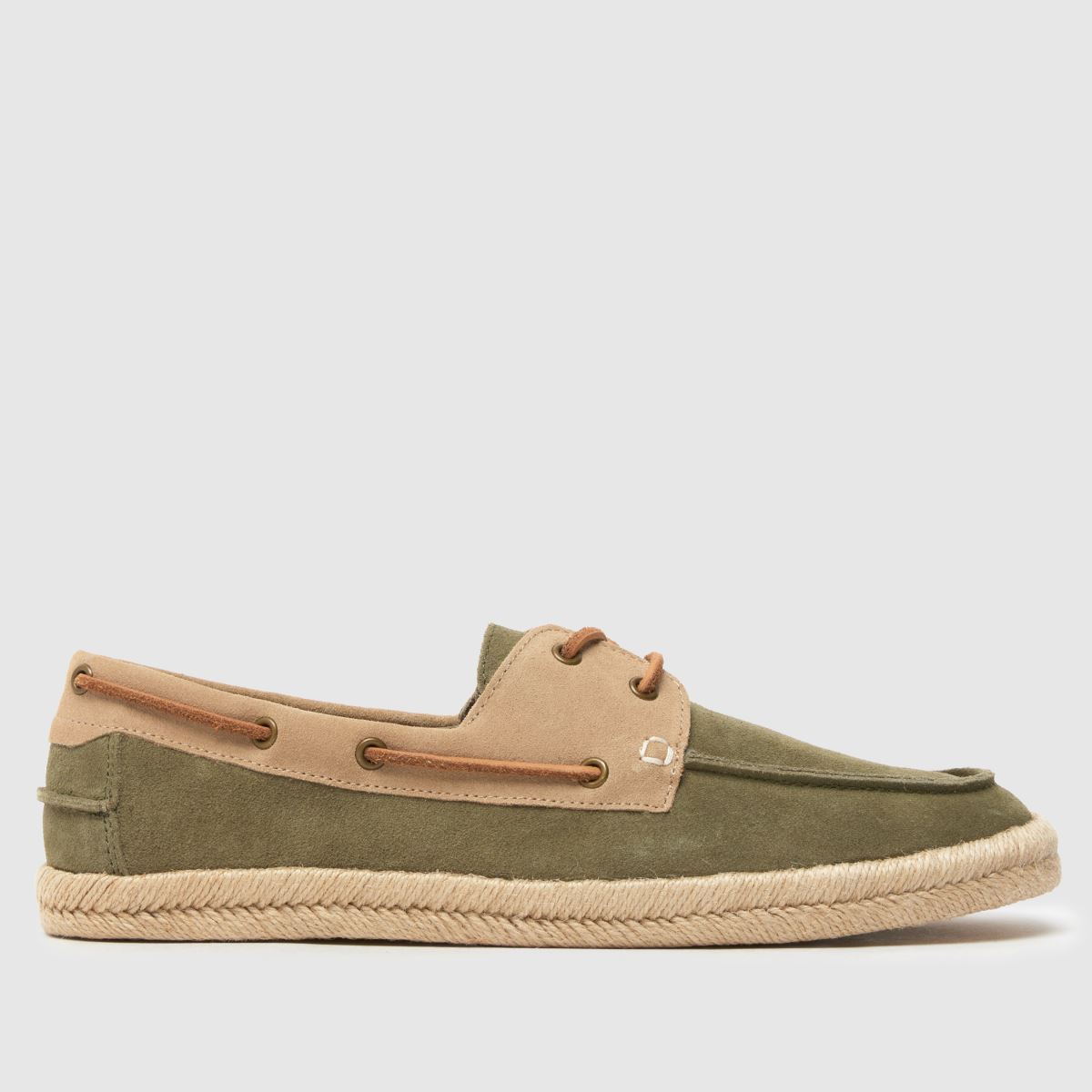 An image of beige and green schuh boat shoes