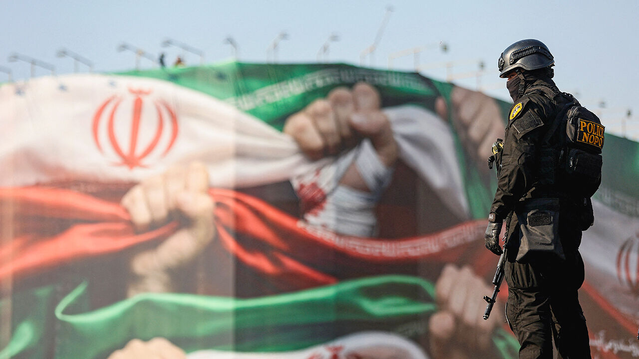 A member of the Iranian police attends a pro-government rally in Tehran, Iran, January 12, 2026