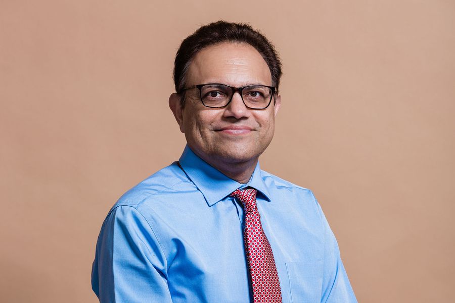 Photo: Arun Upneja poses for a formal headshot portrait