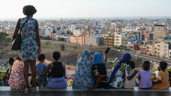 A group of people look of suburban Dakar