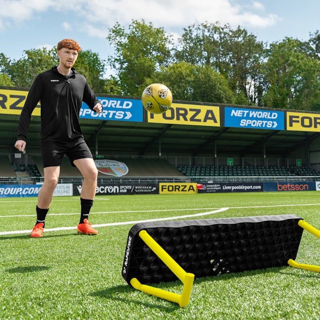 Training set up with the RapidFire Wave Rebound Board and Touch Control Football.