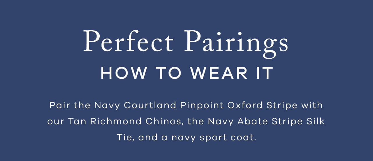Perfect Pairings | How To Wear It | Pair The Navy Courtland Pinpoint Oxford Stripe With Our Tan Richmond Chinos, The Navy Abate Stripe Silk Tie, And A Navy Sport Coat.